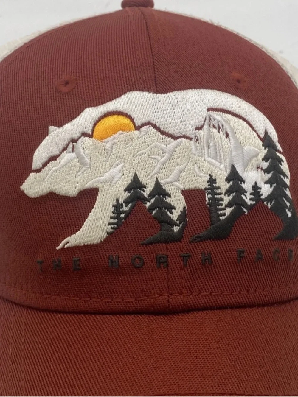 The North Face Rust Trucker Hat with Bear Mountain Embroidery